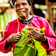 Charity Gakongu wrapping banana leaves on the khat.